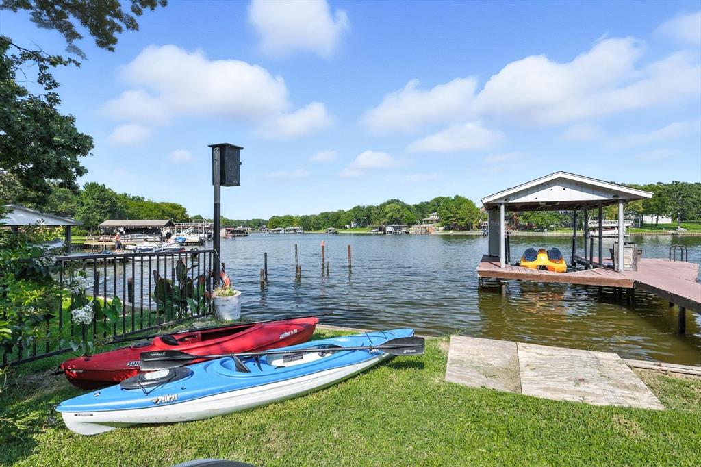 150 Red Bluff Loop Mabank, TX 75156 - Photo 7 of 26 a view of a lake with a house and swimming pool