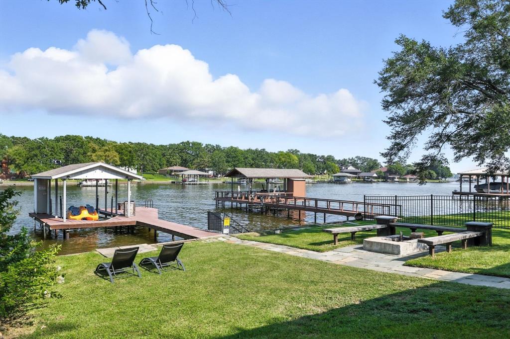 150 Red Bluff Loop Mabank, TX 75156 - Photo 9 of 26 an aerial view of a house with swimming pool and lake view