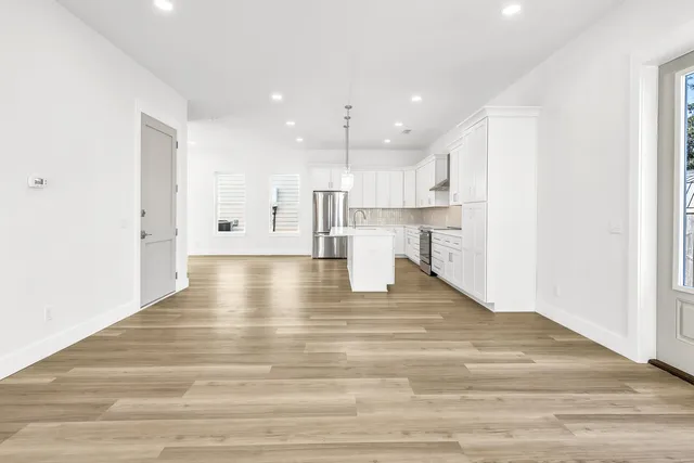 a view of kitchen with wooden floor