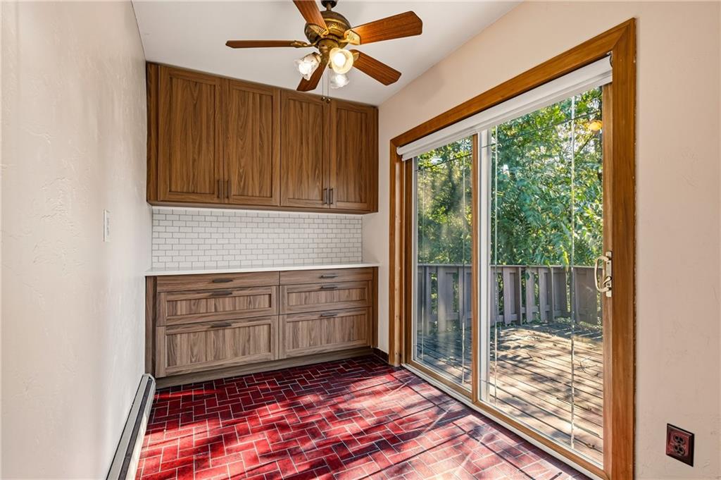 218 Elmore Road Pittsburgh, PA 15221 - Photo 9 of 34 Bonus storage space with sliding glass doors opening toward the deck.