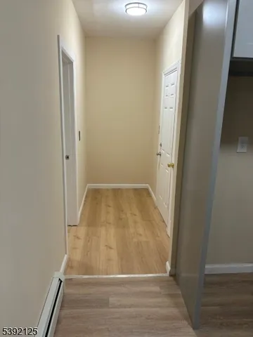 an empty room with wooden floor