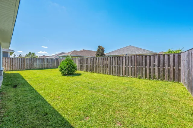 a view of a garden and a fence