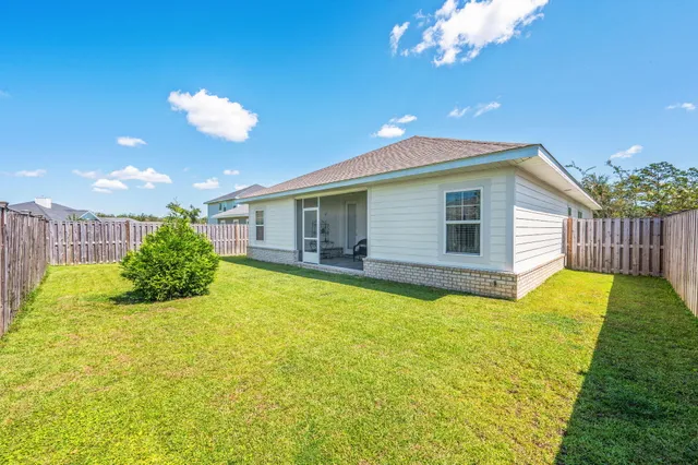a view of a house with swimming pool and porch