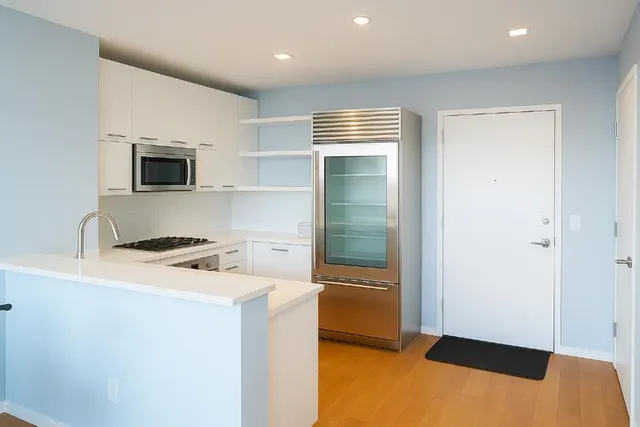 a kitchen with a stove and a microwave