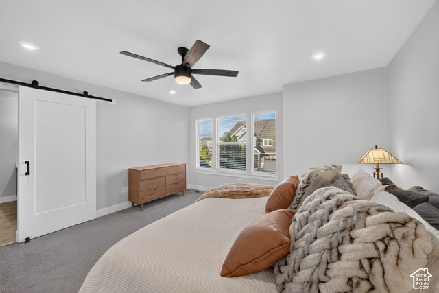 1081 Bowery Way Mapleton, UT 84664 - Photo 22 of 41 Barn door entry, recessed lighting, ceiling fan, carpet flooring, multiple windows with blinds