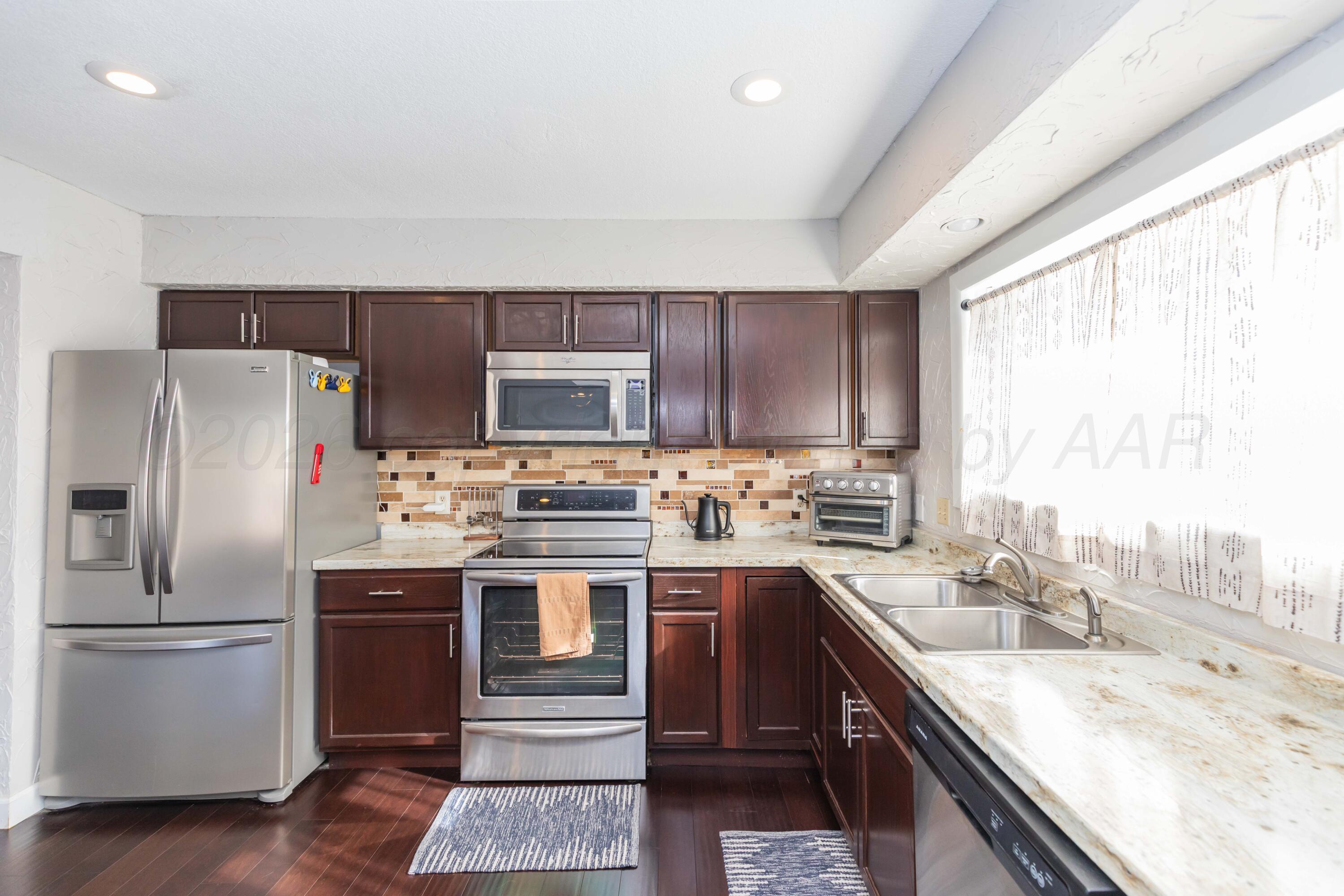 1501 Bailey Avenue Dumas, TX 79029 - Photo 2 of 37 KITCHEN VIEW 3