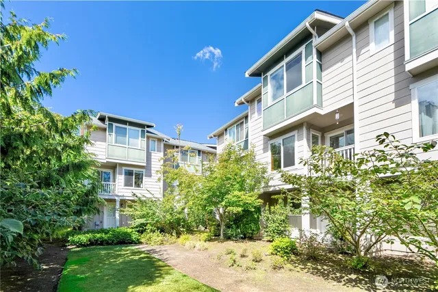 a view of a building with a yard