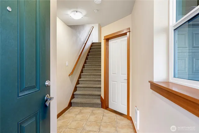 a view of a hallway with staircase