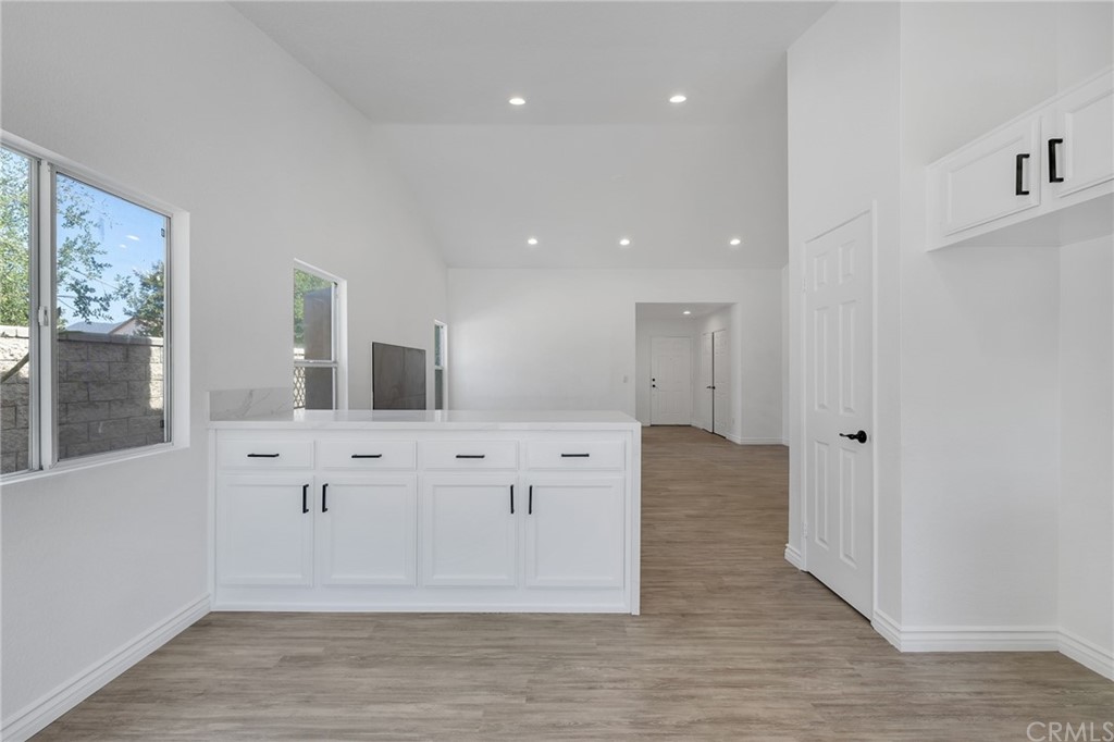 175 Paperbirch Circle Corona, CA 92881 - Photo 12 of 33 a view of cabinets a wooden floor and windows in a room