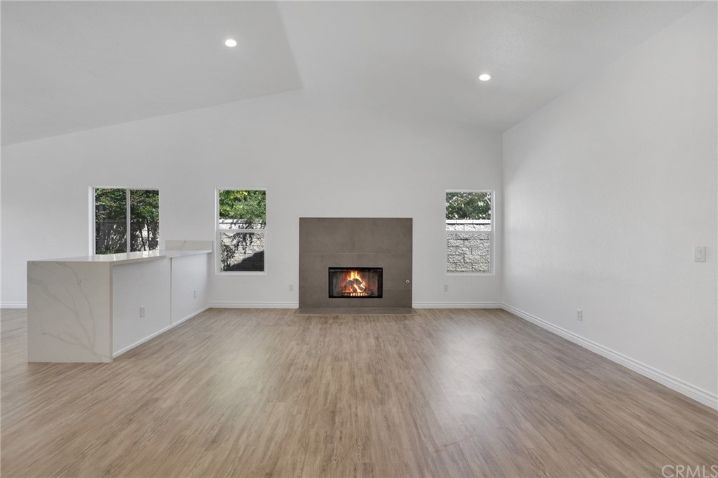 175 Paperbirch Circle Corona, CA 92881 - Photo 14 of 33 an empty room with windows and a fireplace