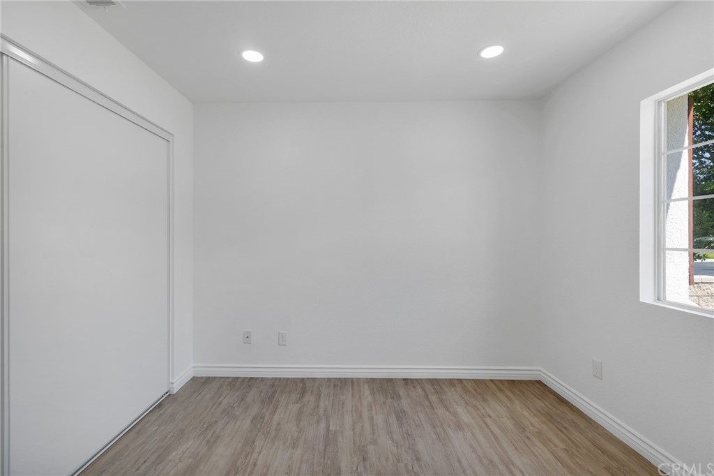 175 Paperbirch Circle Corona, CA 92881 - Photo 16 of 33 wooden floor in an empty room with a window