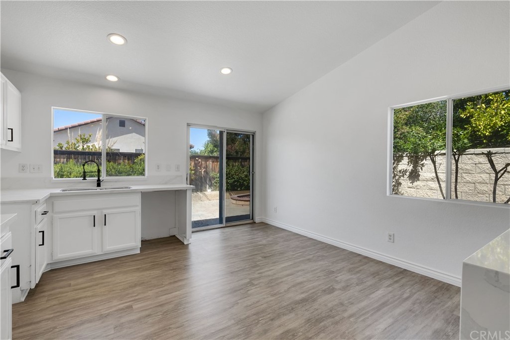 175 Paperbirch Circle Corona, CA 92881 - Photo 18 of 33 a large kitchen with granite countertop a large window and a sink