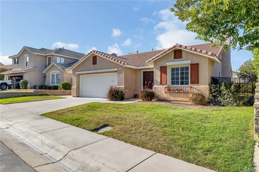 175 Paperbirch Circle Corona, CA 92881 - Photo 2 of 33 a front view of a house with garden