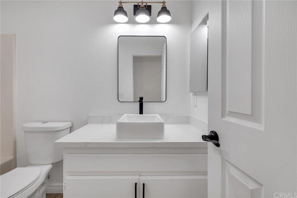 175 Paperbirch Circle Corona, CA 92881 - Photo 21 of 33 a bathroom with a sink and a mirror