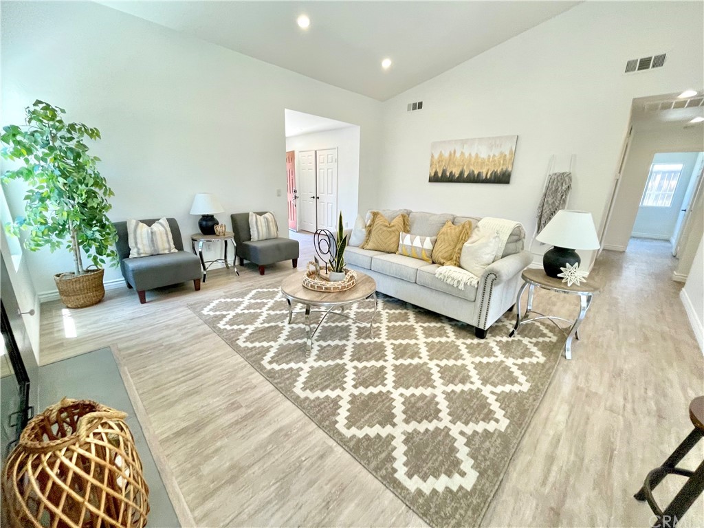 175 Paperbirch Circle Corona, CA 92881 - Photo 3 of 33 a living room with furniture and a potted plant