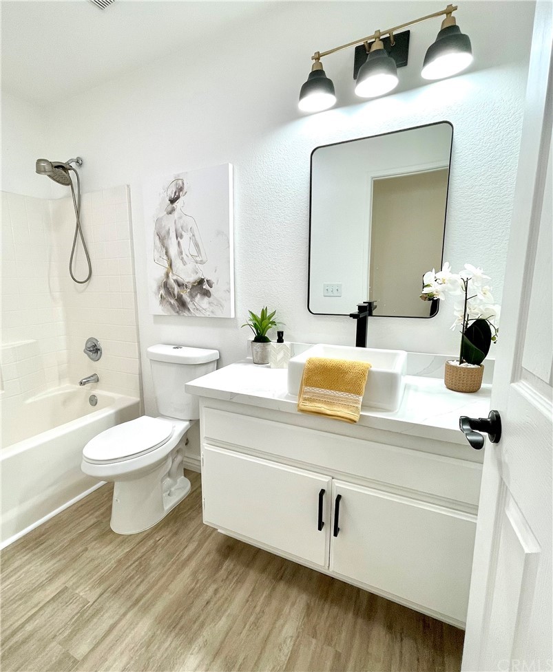 175 Paperbirch Circle Corona, CA 92881 - Photo 5 of 33 a bathroom with a sink a toilet and shower
