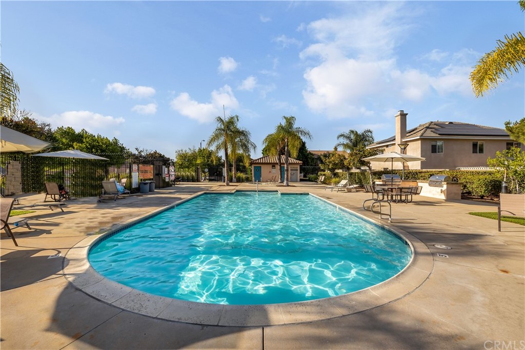 175 Paperbirch Circle Corona, CA 92881 - Photo 10 of 33 a view of a swimming pool with outdoor seating