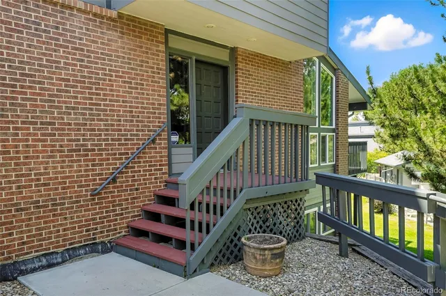 a view of a balcony with chairs