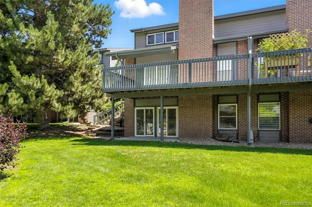 a view of balcony with wooden floor and fence