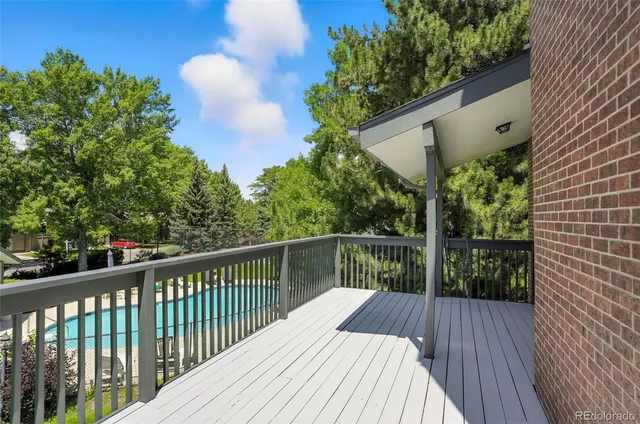 swimming pool view with a seating space