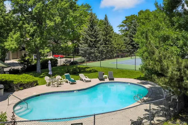 a balcony view with a backyard space