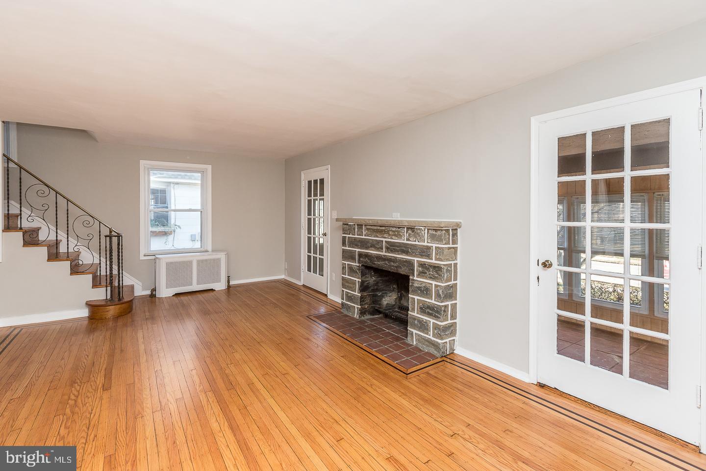 136 Shelbourne Road Havertown, PA 19083 - Photo 11 of 48 a view of empty room with wooden floor and fireplace