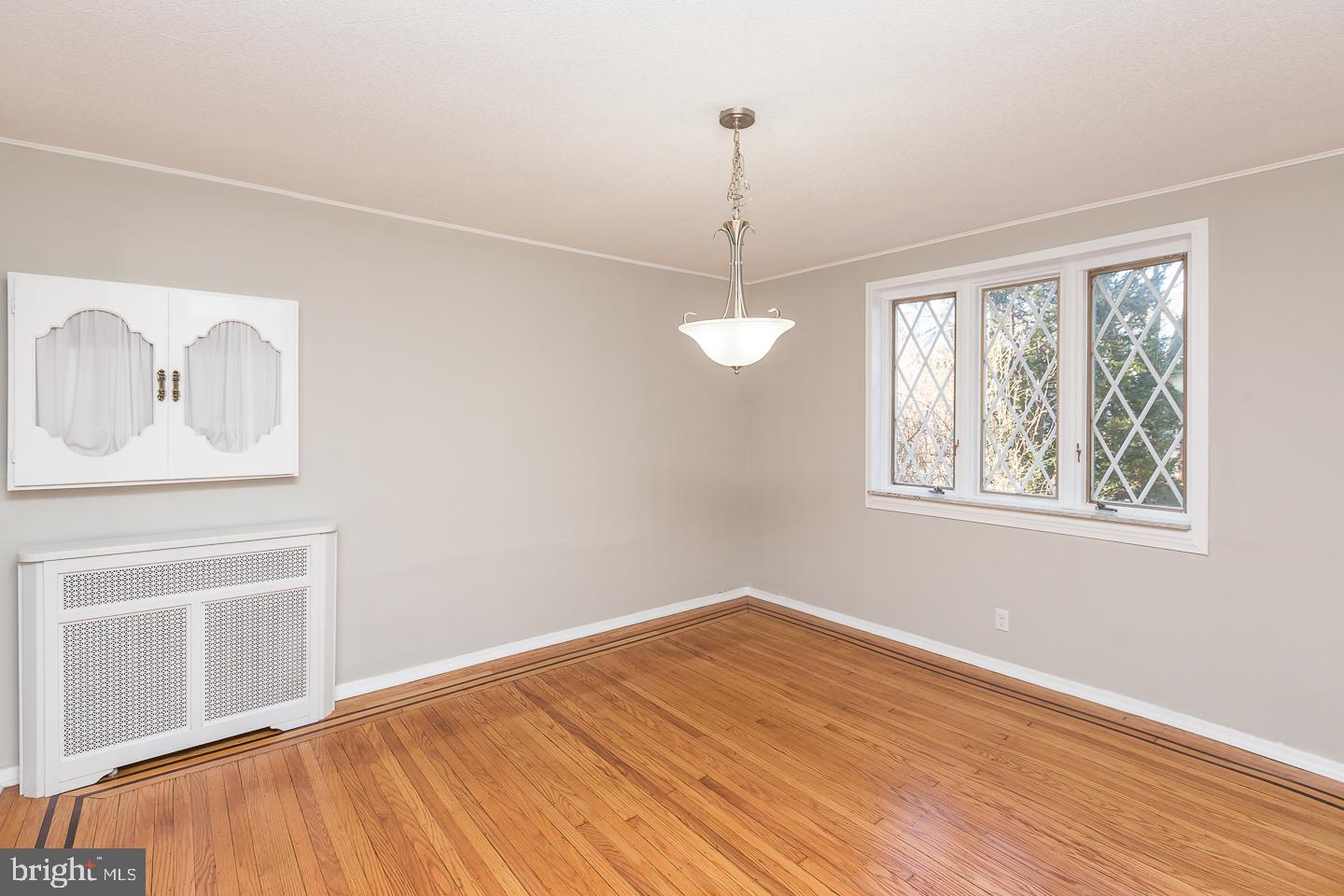 136 Shelbourne Road Havertown, PA 19083 - Photo 18 of 48 a view of empty room with window and wooden floor