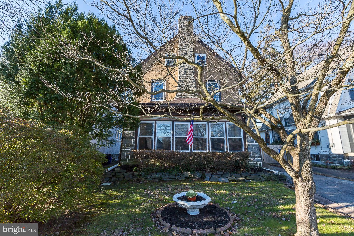 136 Shelbourne Road Havertown, PA 19083 - Photo 3 of 48 a front view of a house with a garden and trees
