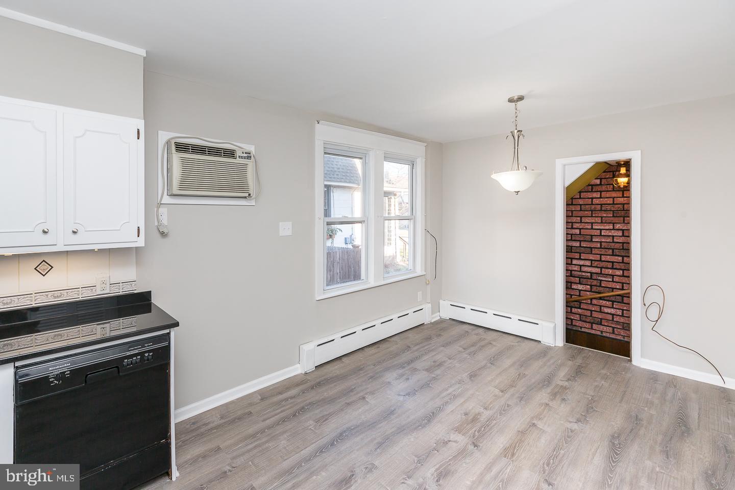 136 Shelbourne Road Havertown, PA 19083 - Photo 22 of 48 a view of an empty room with a window and wooden floor