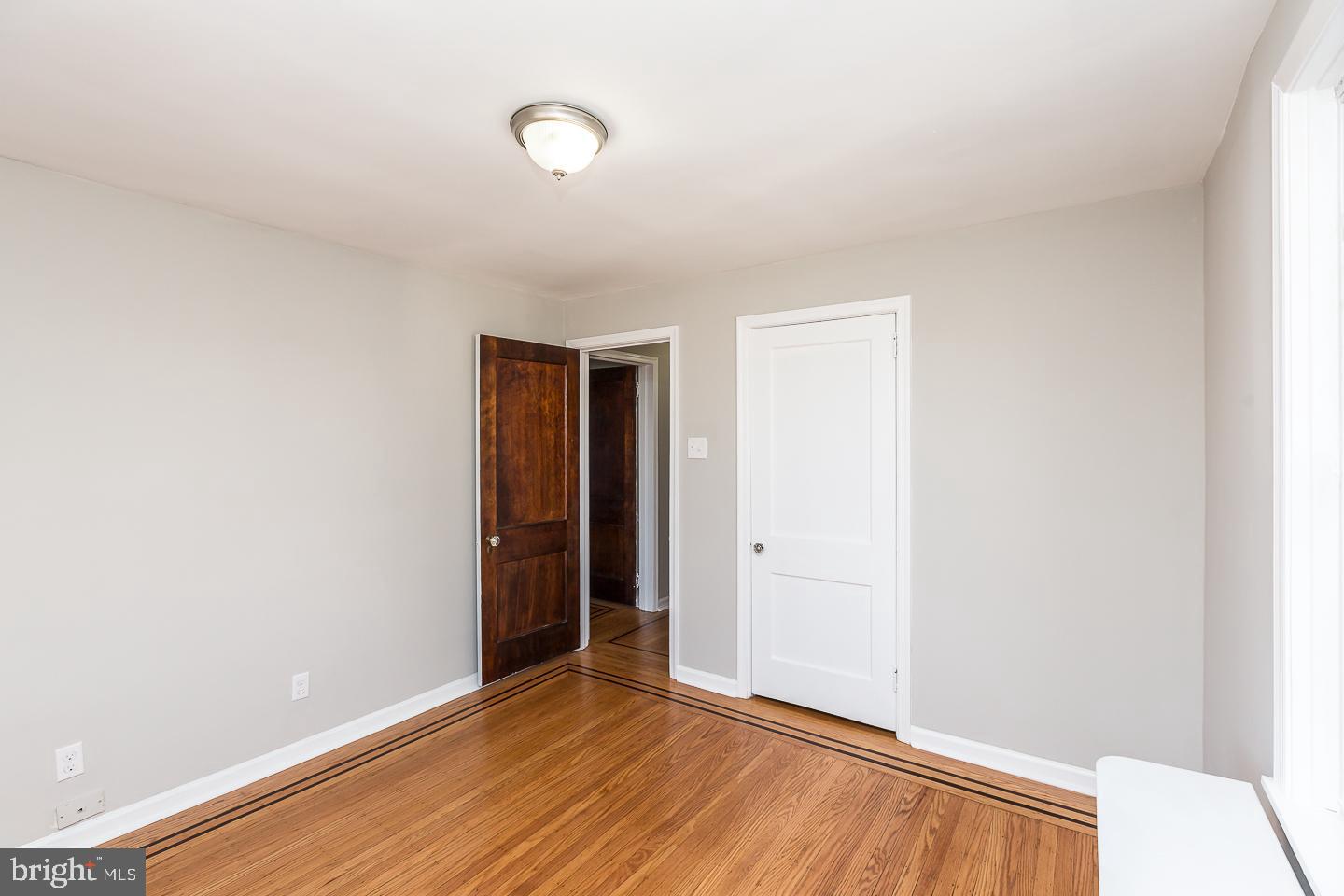 136 Shelbourne Road Havertown, PA 19083 - Photo 26 of 48 a view of an empty room with wooden floor