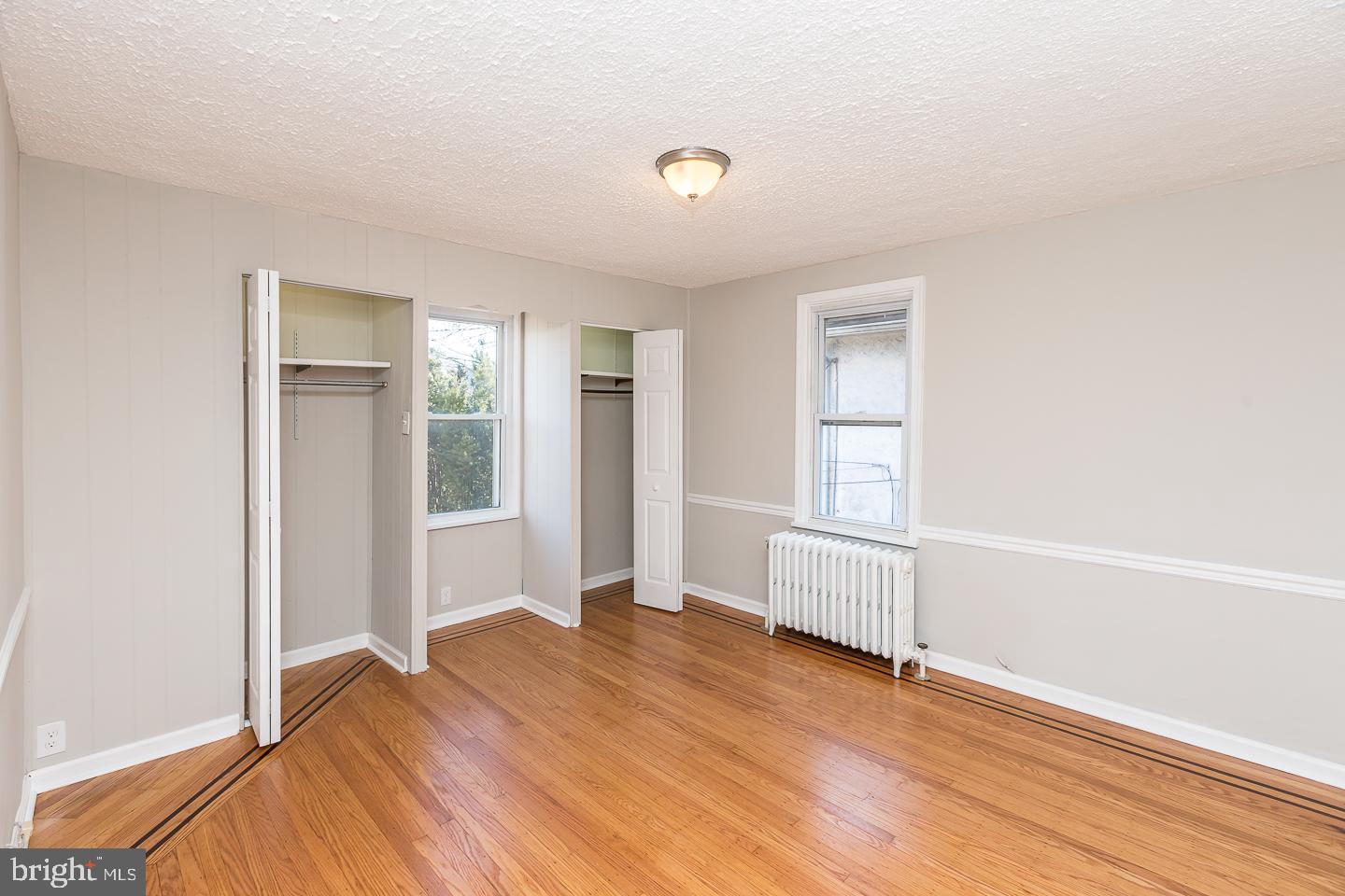 136 Shelbourne Road Havertown, PA 19083 - Photo 27 of 48 a view of empty room with wooden floor and fan
