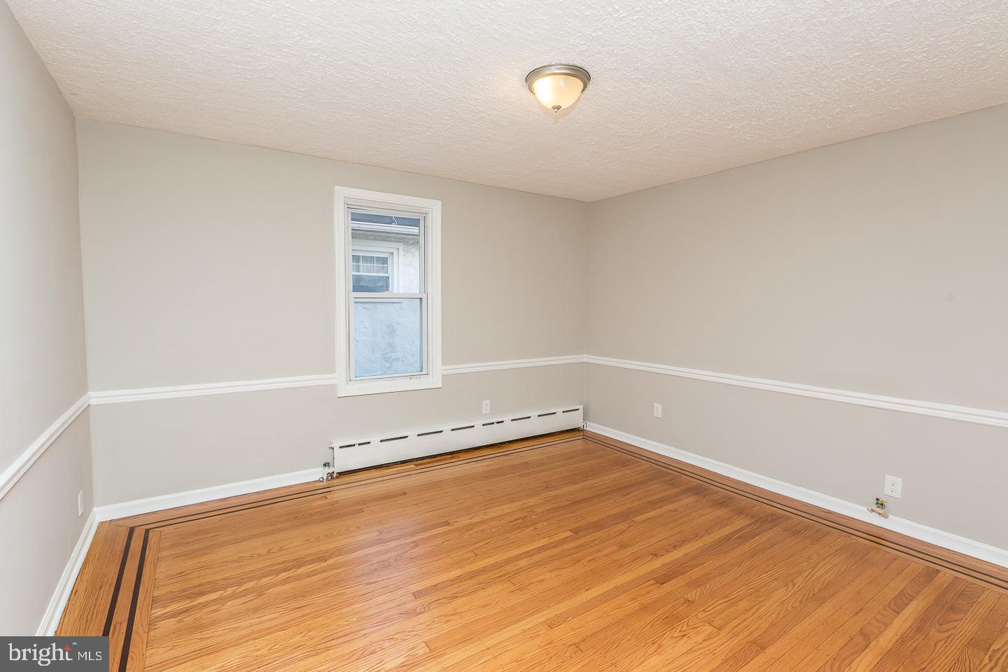 136 Shelbourne Road Havertown, PA 19083 - Photo 30 of 48 a view of a room with wooden floor and window