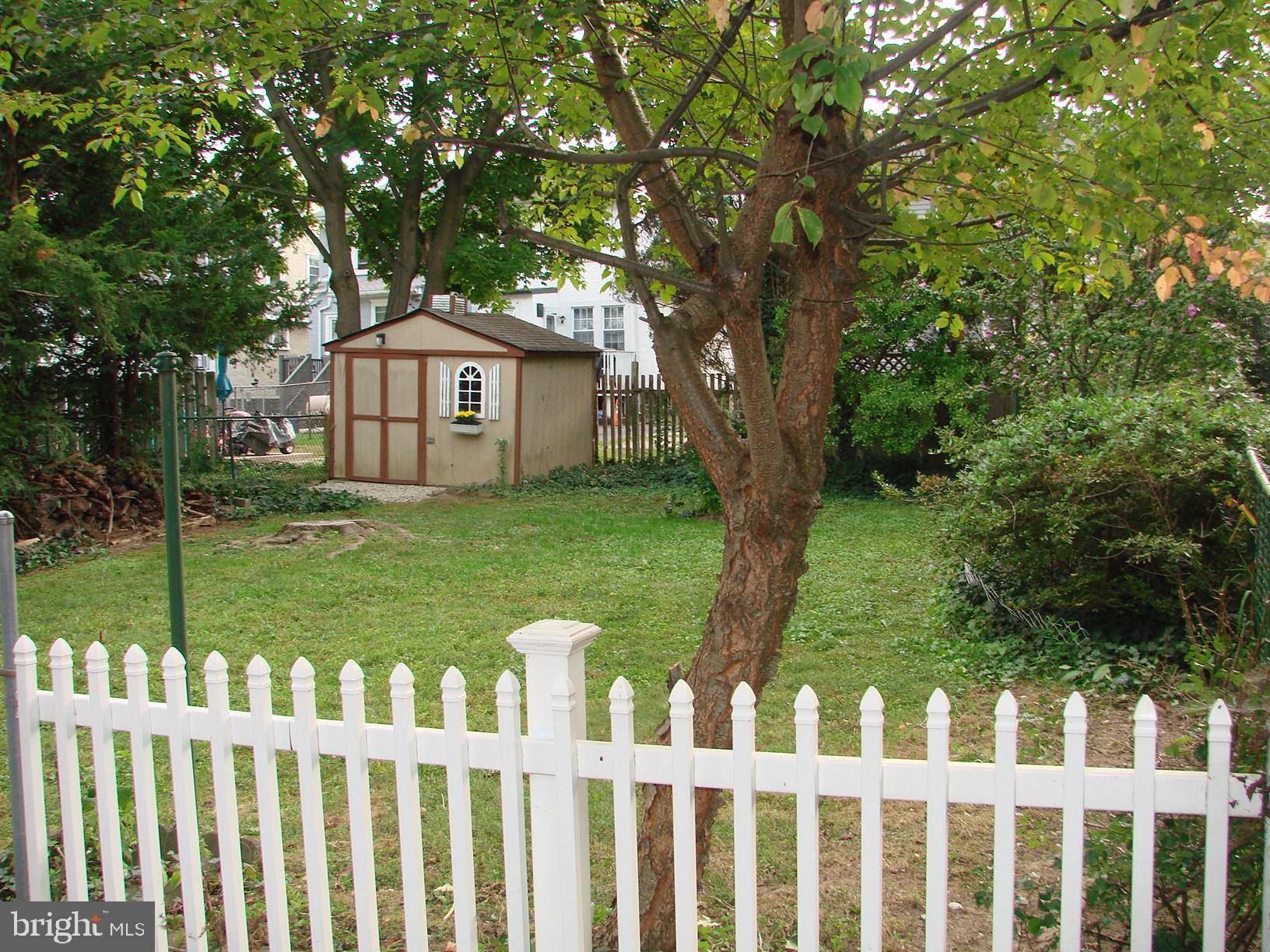 136 Shelbourne Road Havertown, PA 19083 - Photo 5 of 48 a view of a wooden fence and a yard