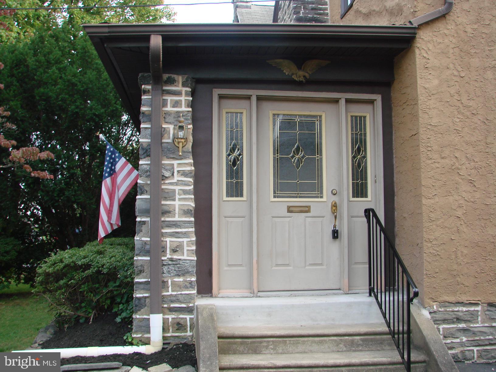 136 Shelbourne Road Havertown, PA 19083 - Photo 8 of 48 a front view of a house with a garden