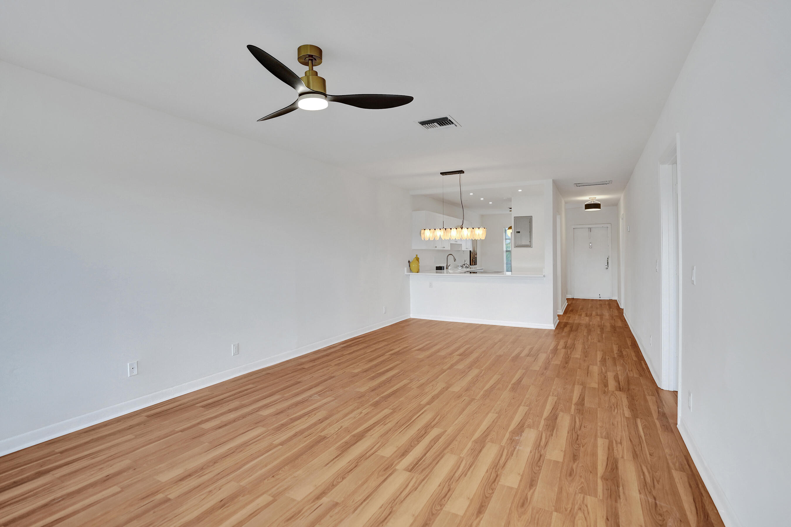 1130 Mahogany Way, Unit 203 Delray Beach, FL 33445 - Photo 11 of 34 a view of empty room with wooden floor