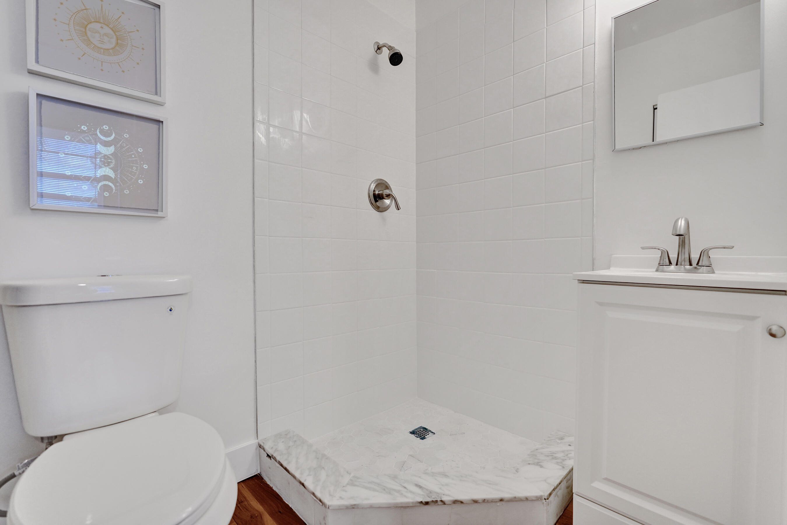 1130 Mahogany Way, Unit 203 Delray Beach, FL 33445 - Photo 22 of 34 a bathroom with a sink toilet and vanity