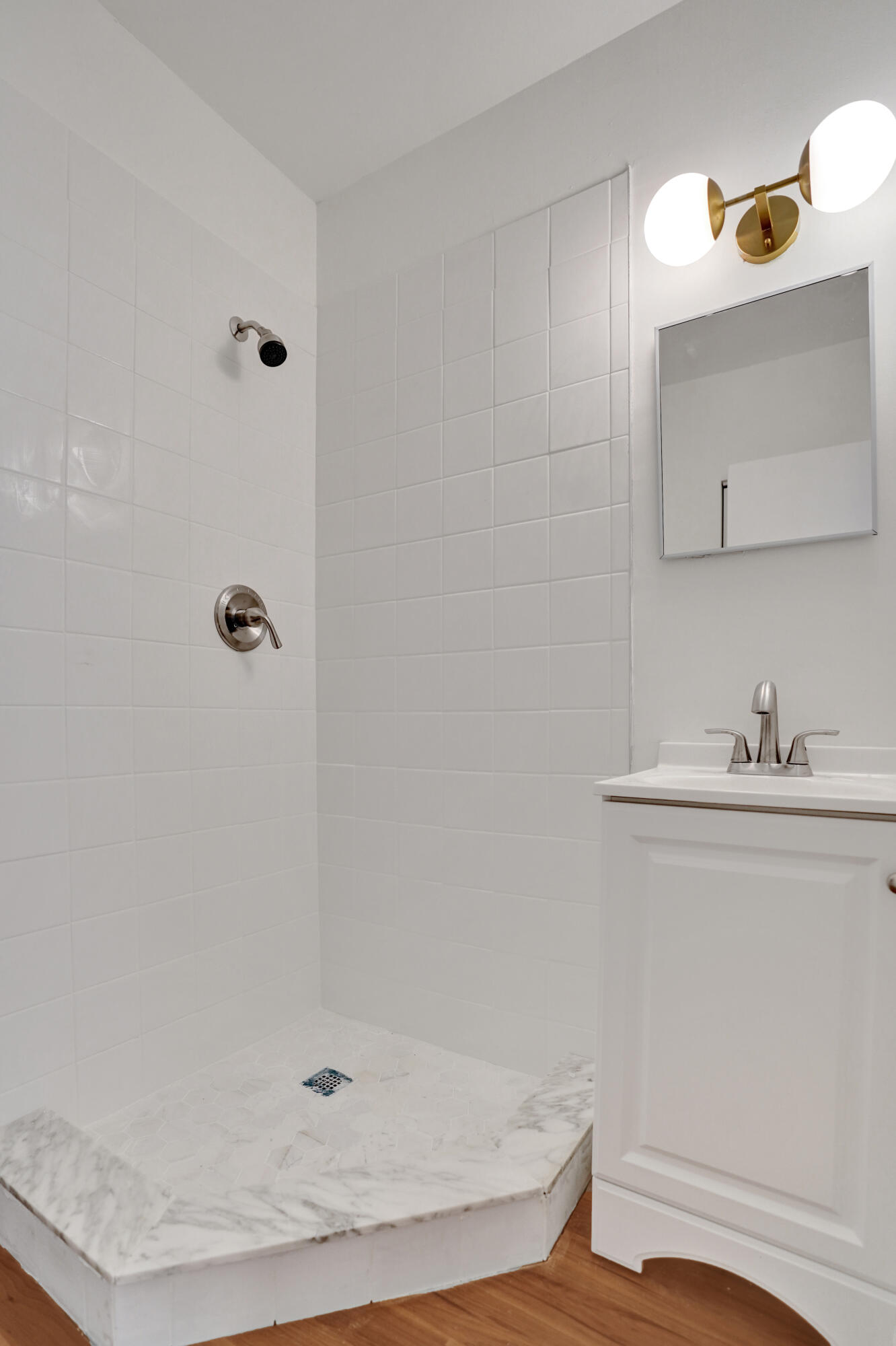 1130 Mahogany Way, Unit 203 Delray Beach, FL 33445 - Photo 23 of 34 a bathroom with a sink and a mirror
