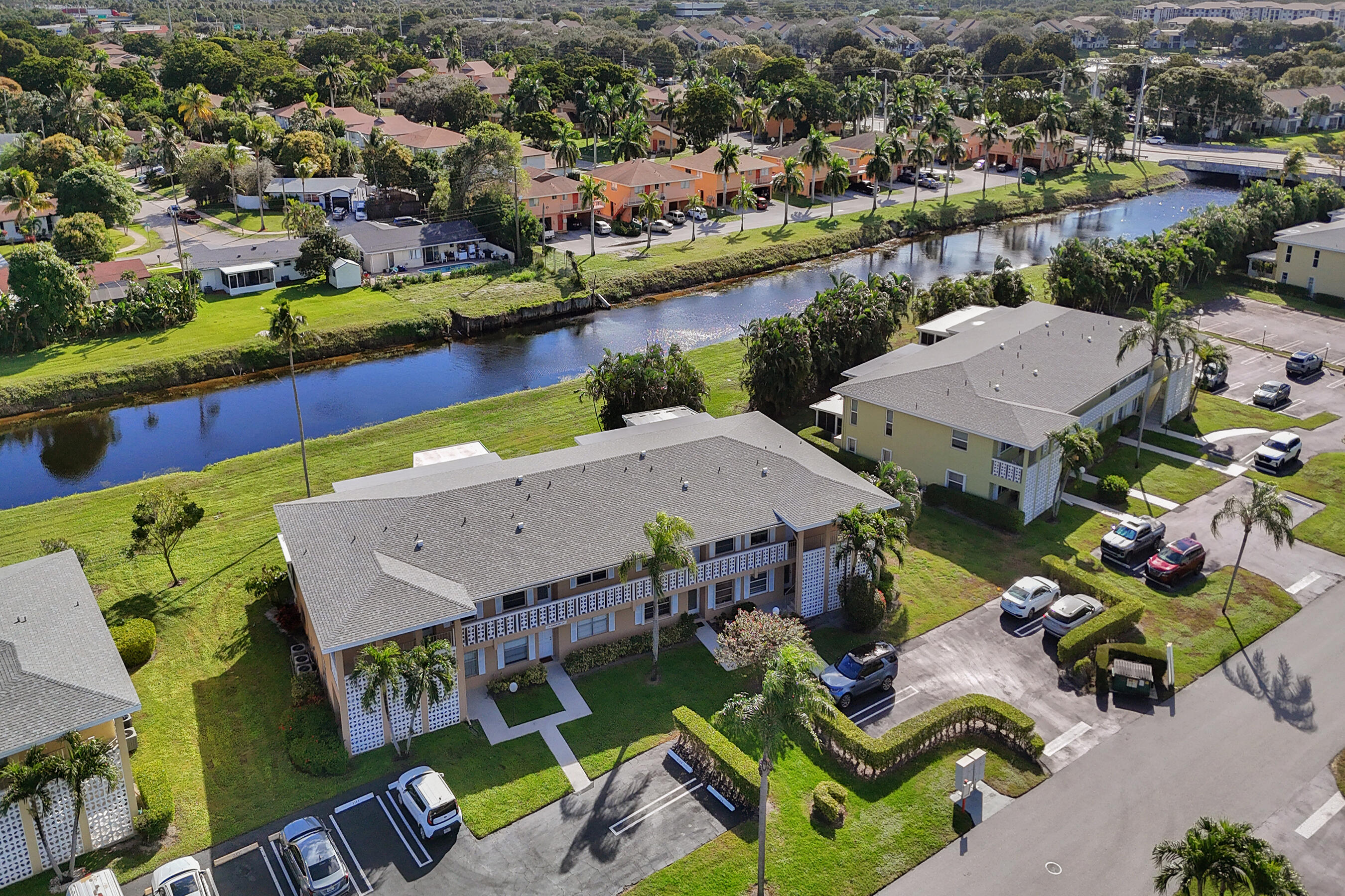 1130 Mahogany Way, Unit 203 Delray Beach, FL 33445 - Photo 24 of 34 an aerial view of residential houses with outdoor space and lake view