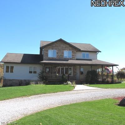 6099 Grove Road Clinton, OH 44216 - Photo 1 of 20 Front of home with wrap around porch!
