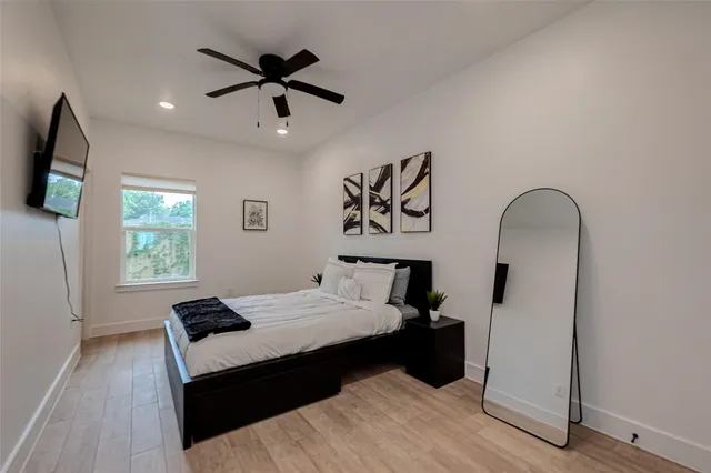 a bedroom with a bed and a window