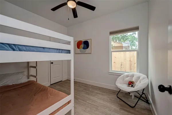 a bedroom with furniture and window