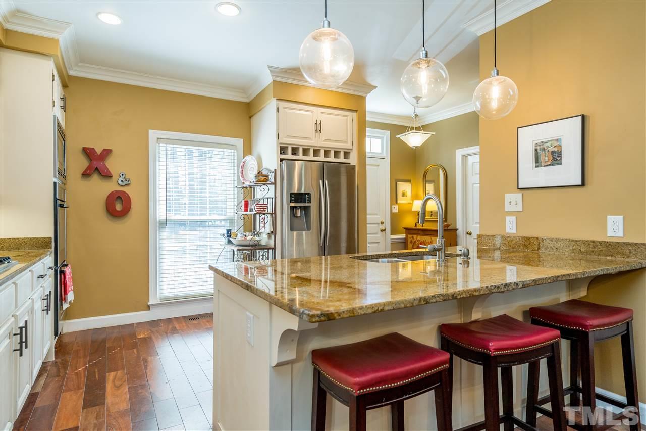 717 Weathergreen Drive Raleigh, NC 27615 - Photo 12 of 30 Stainless steel appliances, beautiful wood flooring, white cabinets, granite counters, gas cook top, plus more!