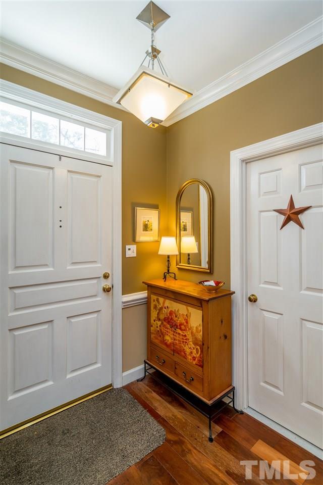 717 Weathergreen Drive Raleigh, NC 27615 - Photo 6 of 30 Stunning Patagonia Rosewood Hardwoods welcome you into this beautifully renovated home