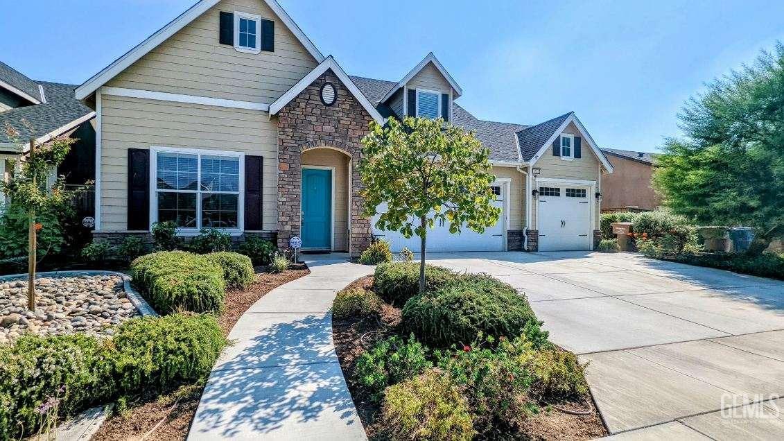 a front view of a house with garden