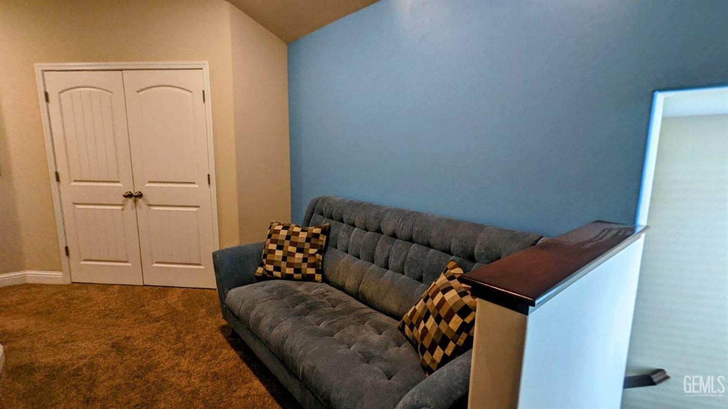 Undisclosed Address Shafter, CA 93263 - Photo 11 of 31 a living room with furniture and a rug