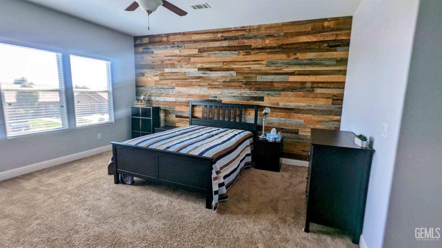 Undisclosed Address Shafter, CA 93263 - Photo 13 of 31 a bedroom with a bed and a window