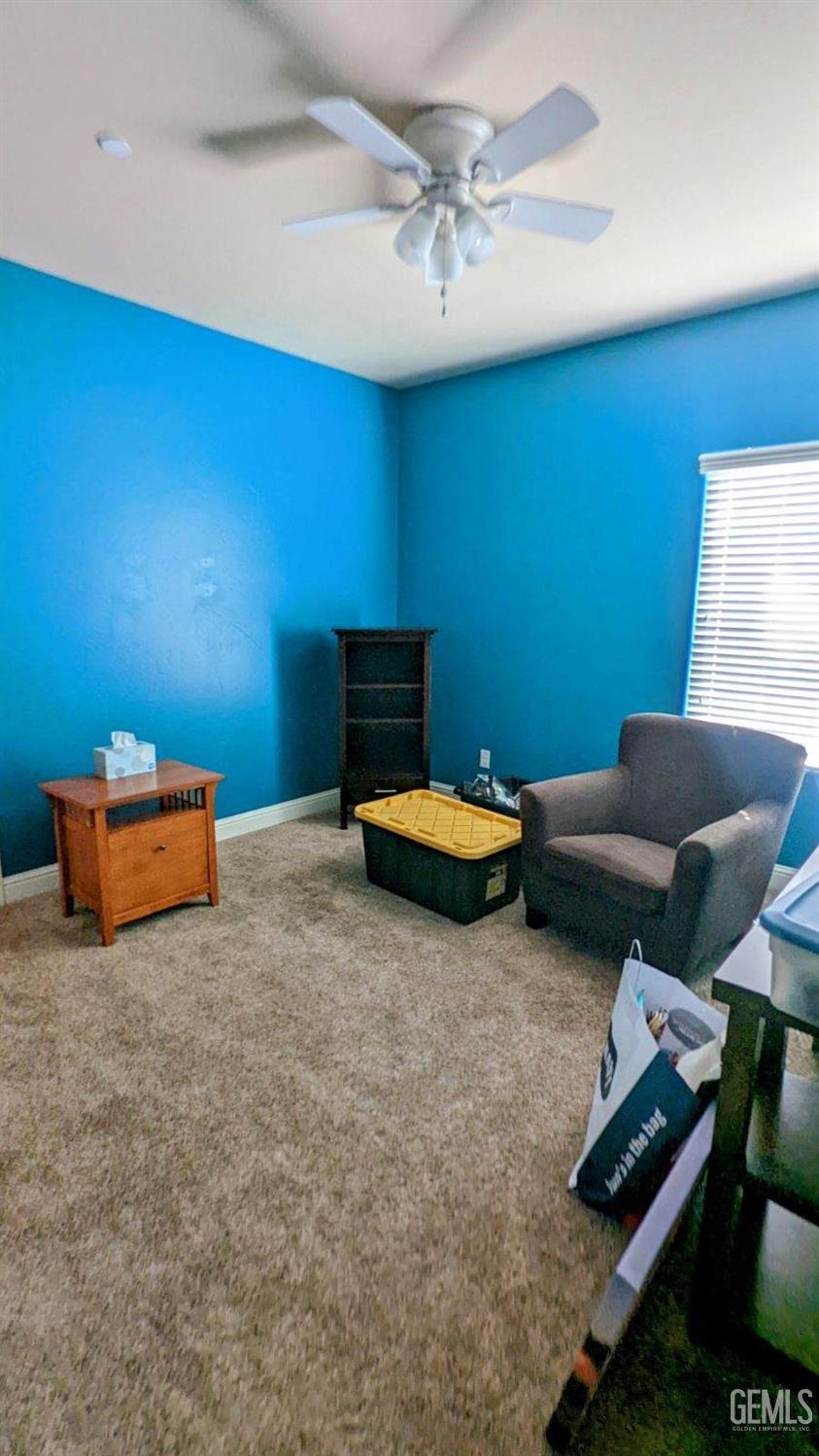 Undisclosed Address Shafter, CA 93263 - Photo 18 of 31 a living room with furniture and a projector