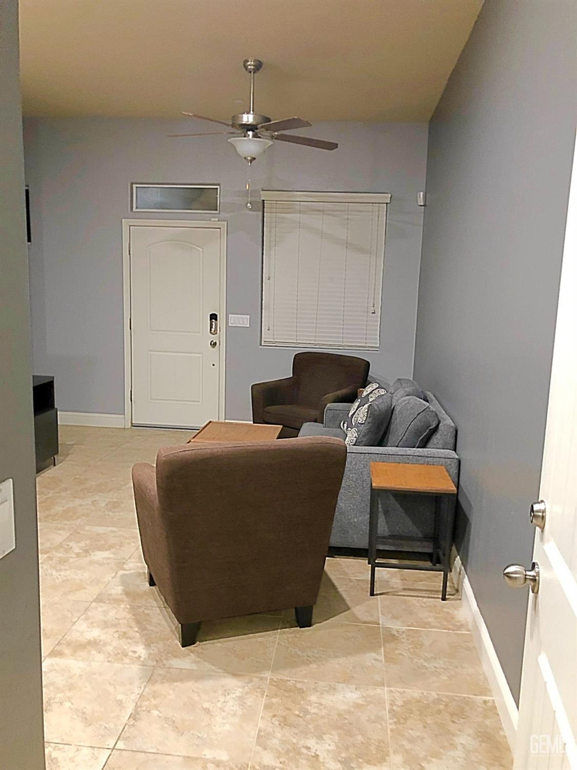 Undisclosed Address Shafter, CA 93263 - Photo 21 of 31 a living room with furniture and a rug