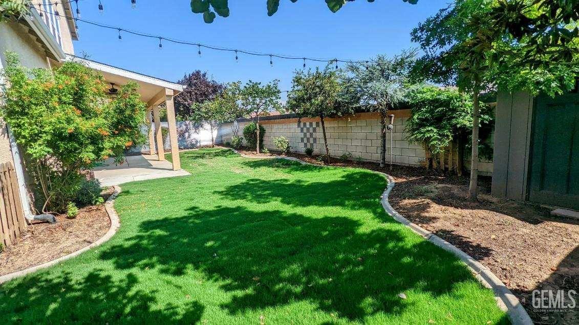 Undisclosed Address Shafter, CA 93263 - Photo 29 of 31 a backyard of a house with lots of green space