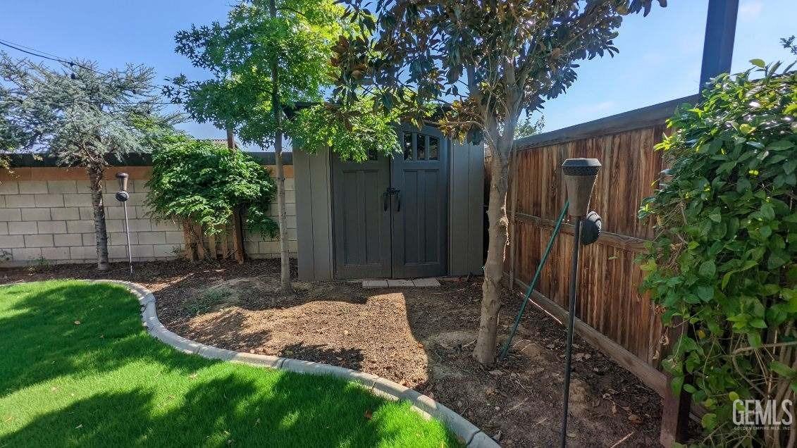 Undisclosed Address Shafter, CA 93263 - Photo 30 of 31 a view of a backyard with tree